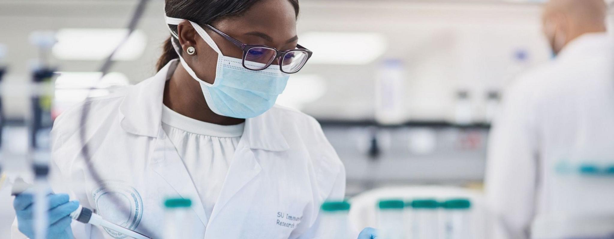 A young scientist conducting medical research in a laboratory.