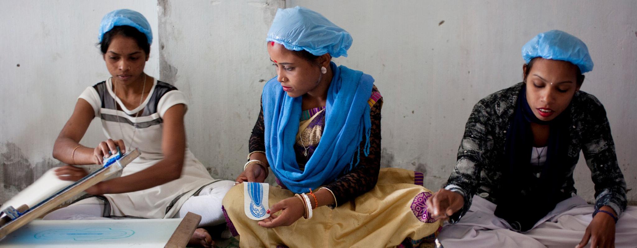 Women working at the Sanitary Pad Unit on the Amgoorie Tea Estate in Assam, India