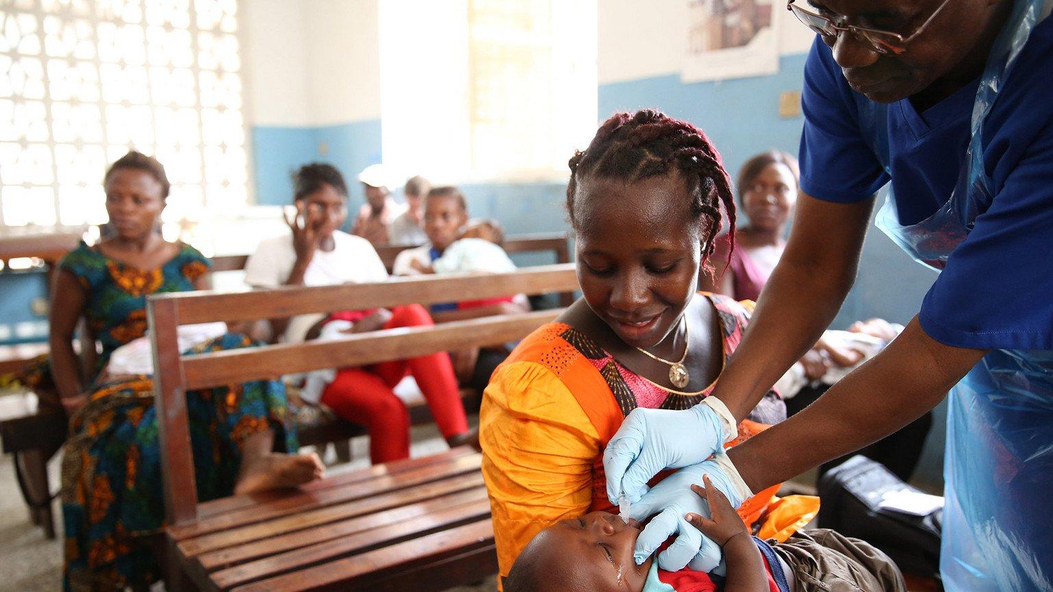 A five week old boy gets the Ebola vaccine. 