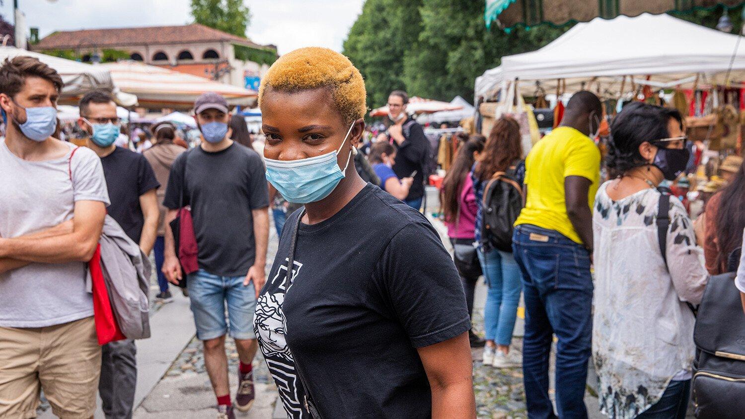 People at a street flea market in Italy.