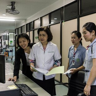 Cherry and medical team on the hospital hallway.