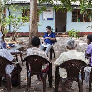 Upul surrounded by villagers