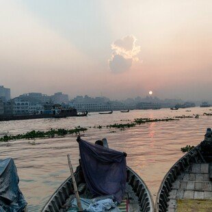 Boat driver with a mosquito net at Keraniganj port on the Buriganga river