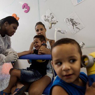 Two children about to be vaccinated as part of the TV003 dengue vaccine trial