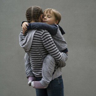 Portrait of a young Ukrainian mother, who is HIV positive, holding her son