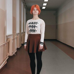 Young woman standing in a corridor in the City for the Blind community