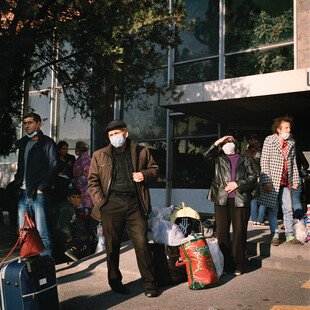 Displaced persons from Nagorno-Karabakh wait in Yerevan, Armenia, to be bussed to temporary housing.