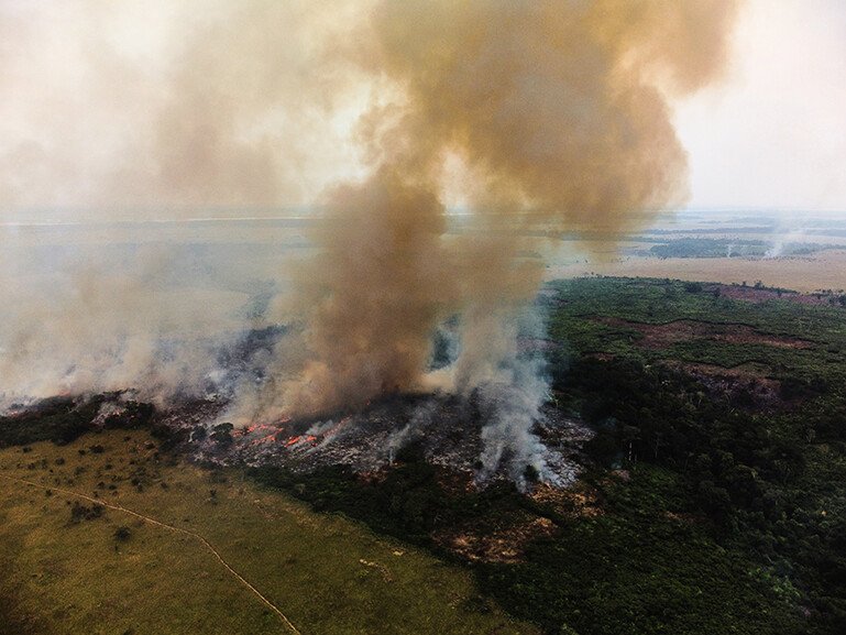 Aerial views of bush fires started by farmers in Kwilu province.