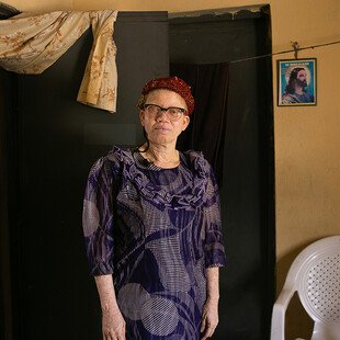 Victoria, a Nigerian woman with albinism, stands for a portrait.