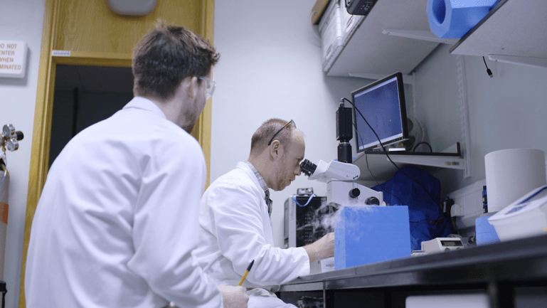 Stephen and one of his PhD students in the lab