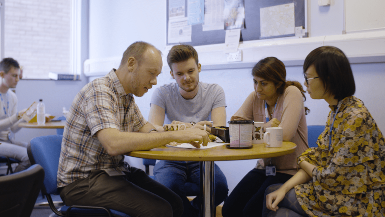 Stephen and his team at the one of their team meetings