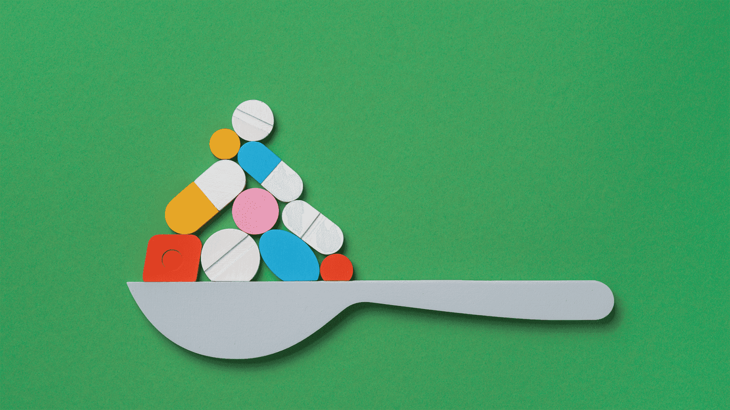 Illustration of a spoon with pills